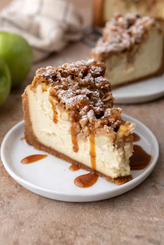 apple crisp cheesecake recipe slice with caramel on top