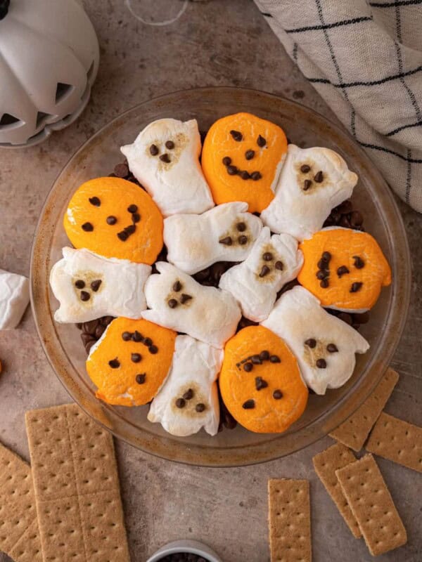 chocolate chips in a baking dish with marshmallows on top fully baked