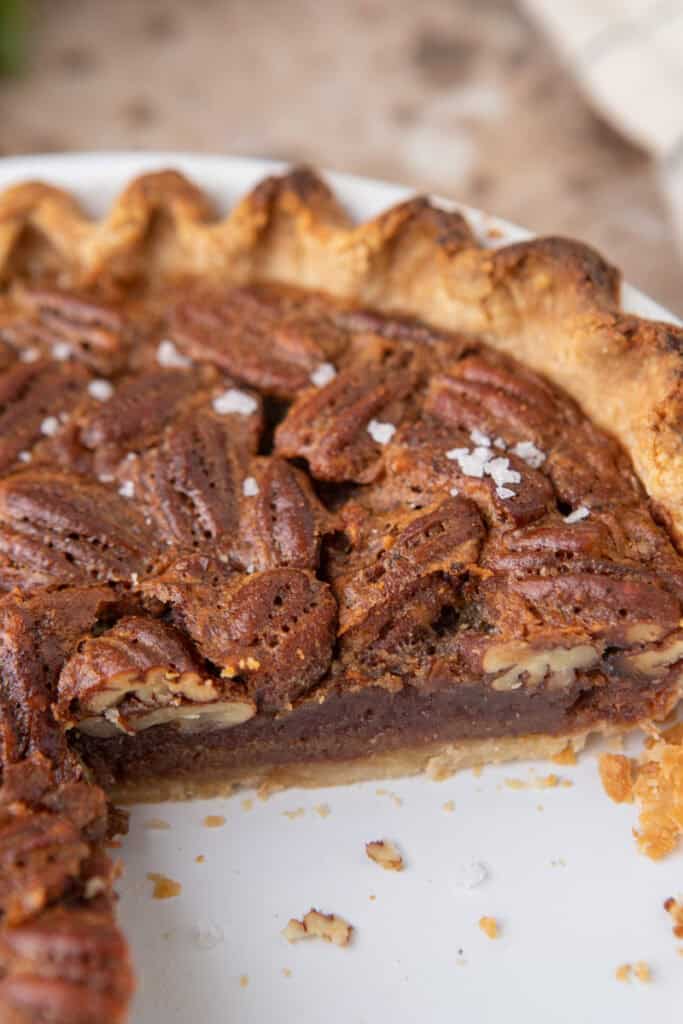 maple pecan pie with a slice taken out