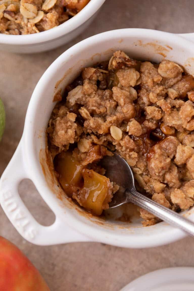 Microwave Apple Crisp for One recipe in a mug with a spoon