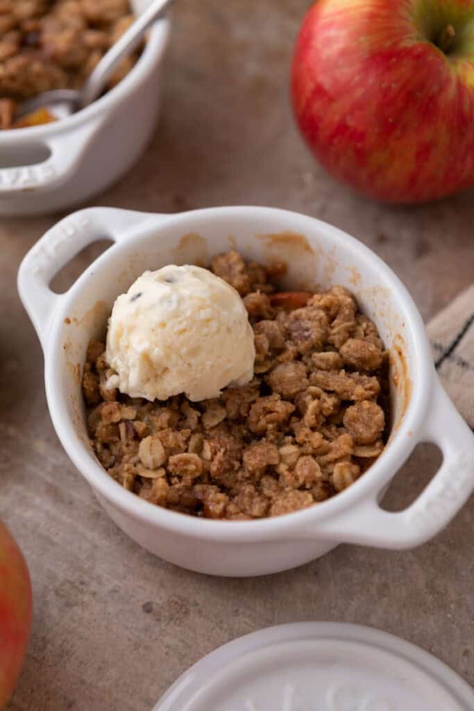 Microwave Apple Crisp for One recipe in a bowl with ice cream