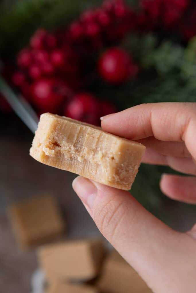 microwave peanut butter fudge recipe being held up by a hand