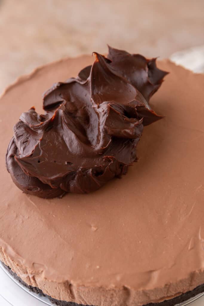 ganache being spread onto the filling