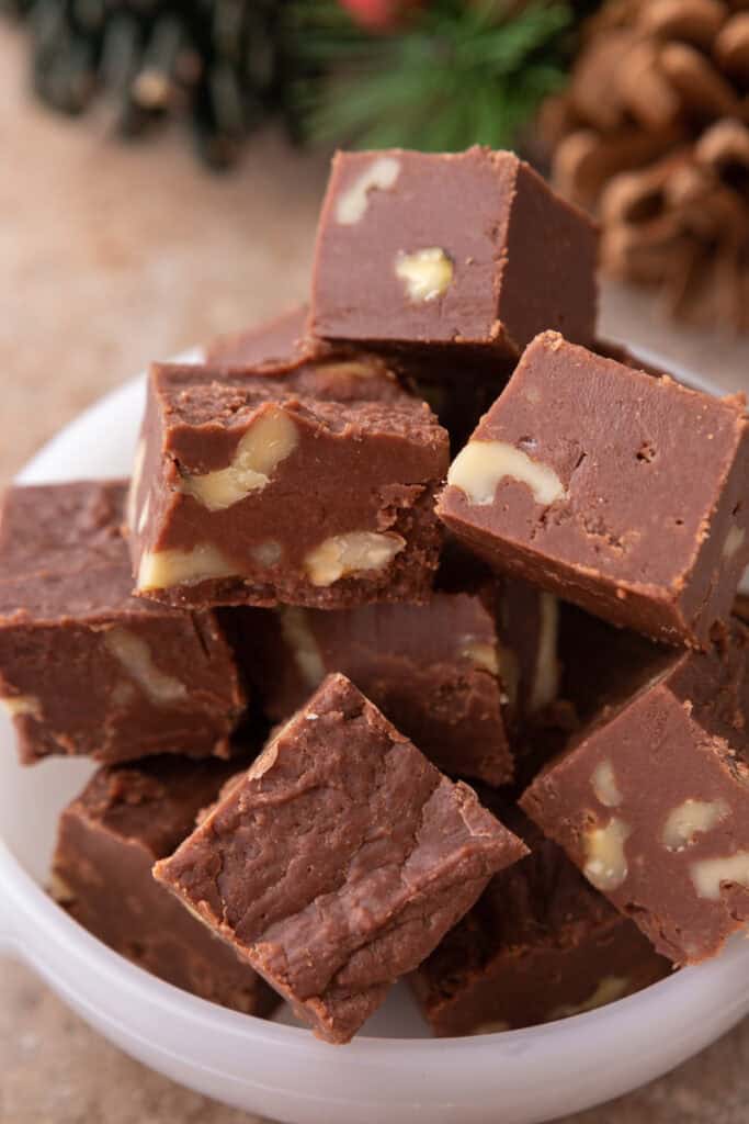 see's candy fudge recipe pieces stacked in a bowl