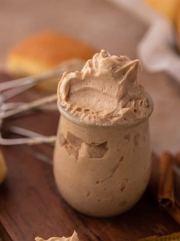 texas roadhouse cinnamon butter in a cup with a scoop taken out