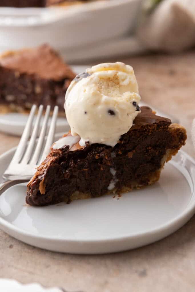 brownie pie recipe slice with ice cream on top