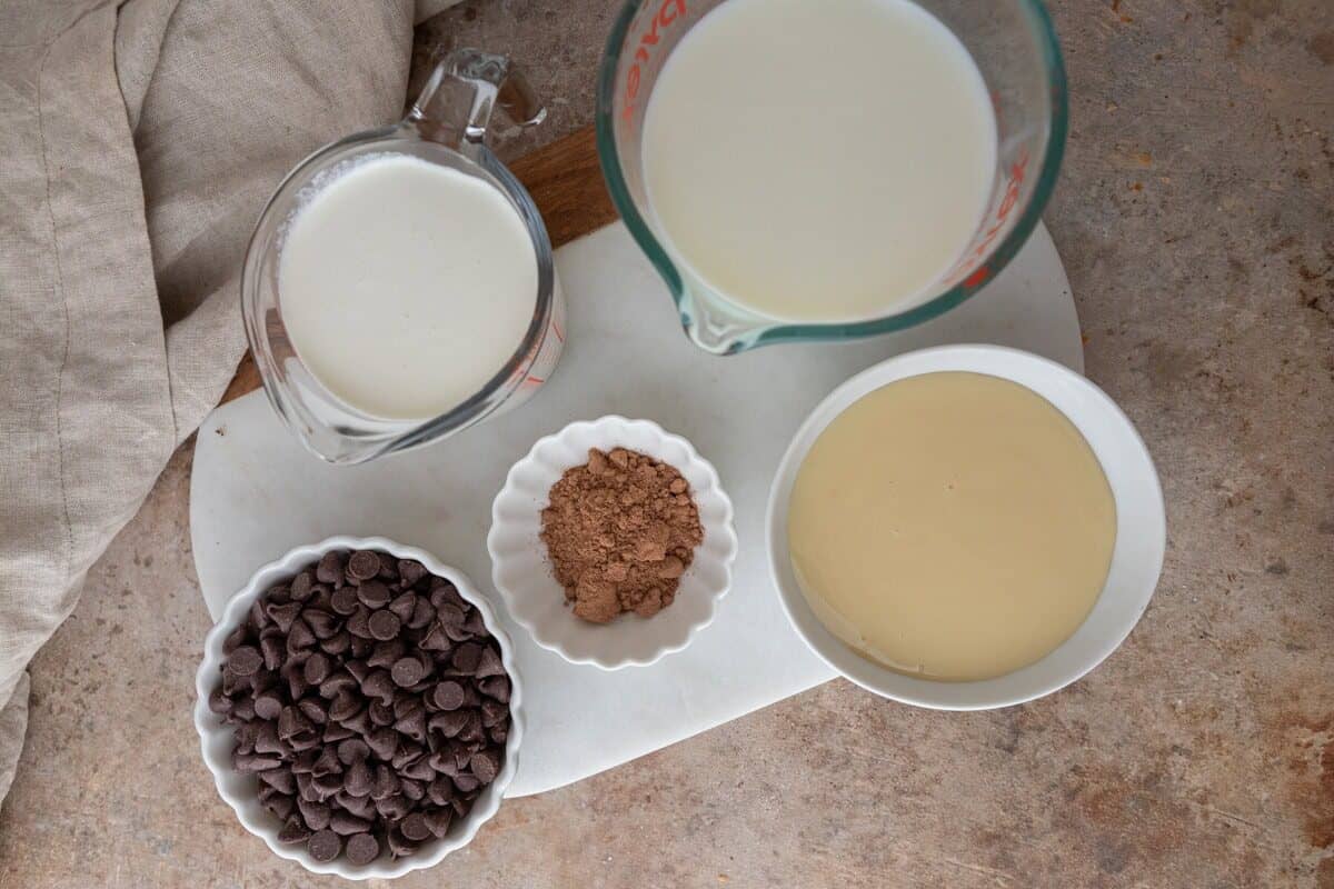Ingredients including milk, cream, cocoa powder, chocolate chips, and sweetened condensed milk.