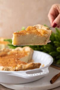 egg pie recipe being held up by a hand