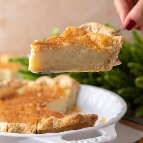 egg pie recipe being held up by a hand