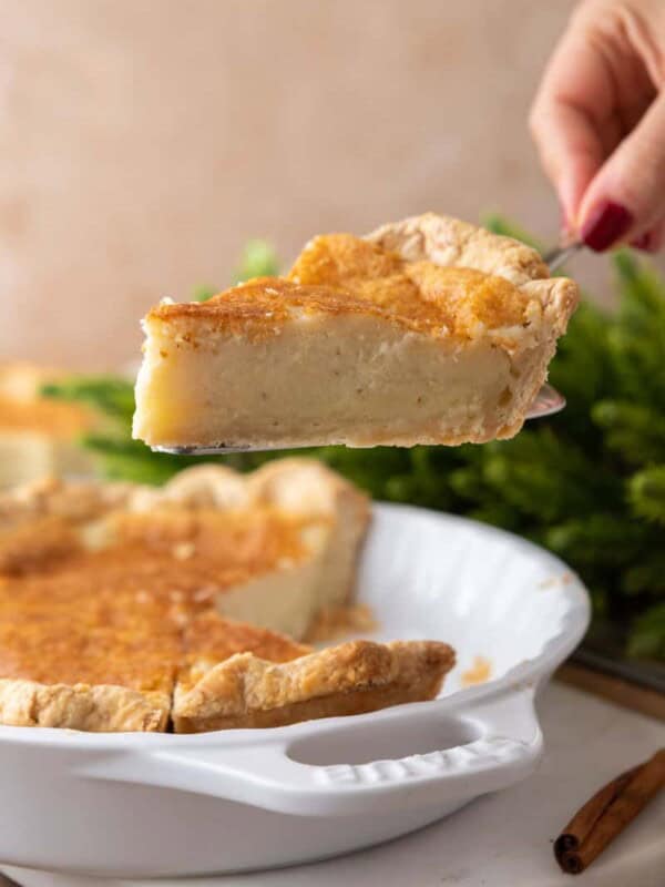 egg pie recipe being held up by a hand