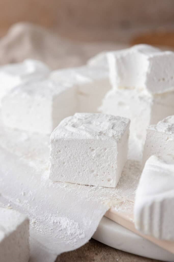 homemade marshmallows laid out on parchment