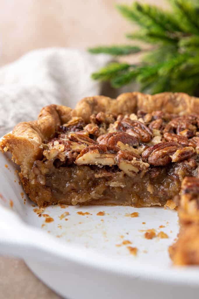 side view of the traditional pecan pie recipe in a dish