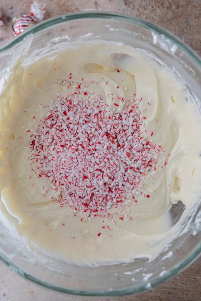 Crushed peppermint candy canes on top of cheesecake batter before being folded in