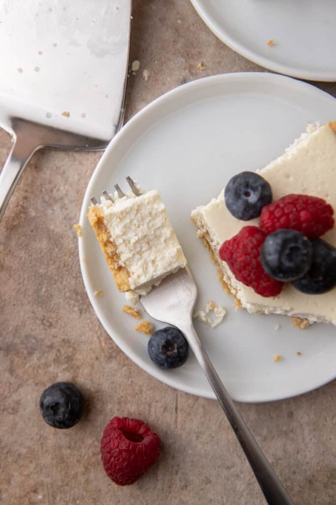 High Protein Cottage Cheese Cheesecake being scooped up on a fork