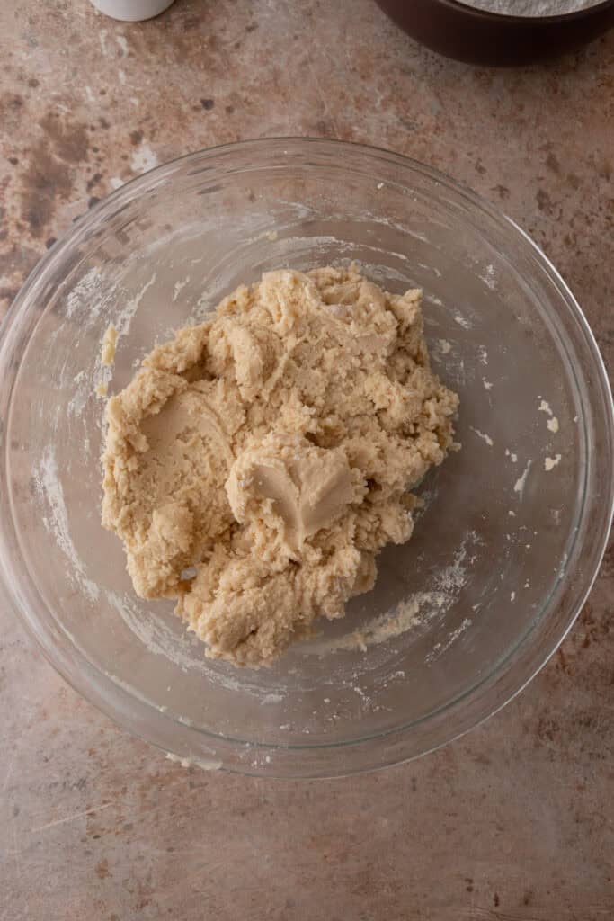 Cookie dough mixed in a glass bowl.
