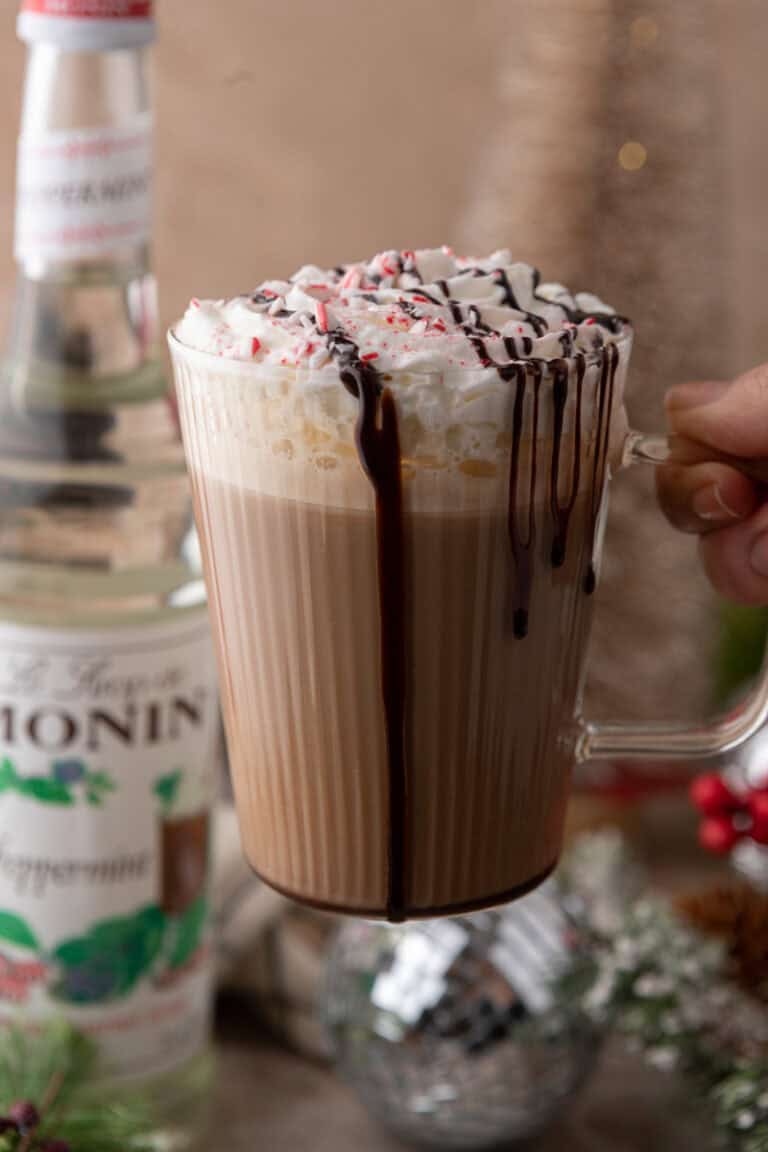 peppermint mocha starbucks recipe being held up by a hand