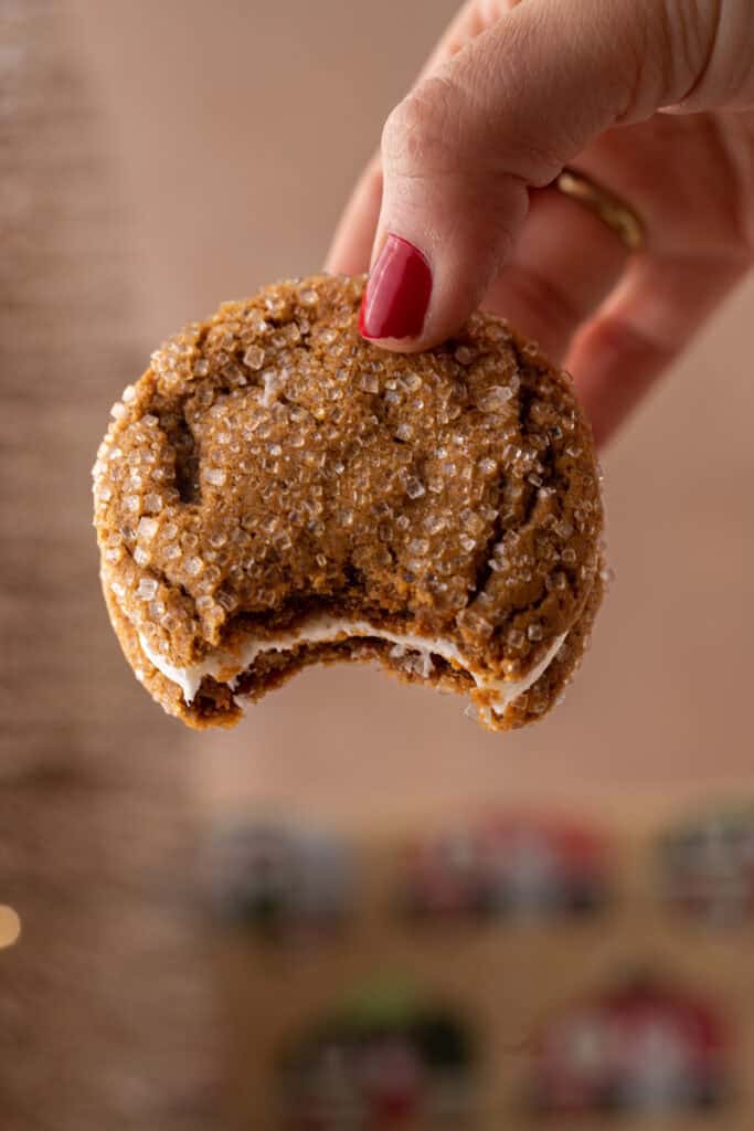 ginger molasses cookie sandwiches being held up by a hand