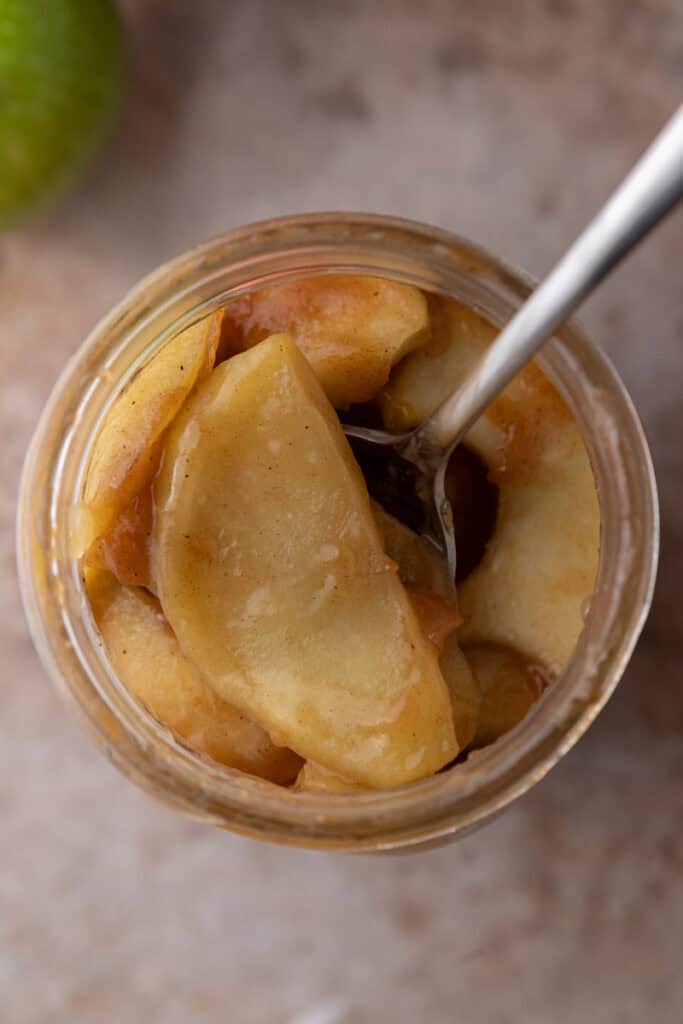 overhead of apples in the jar from the how to make apple filling recipe