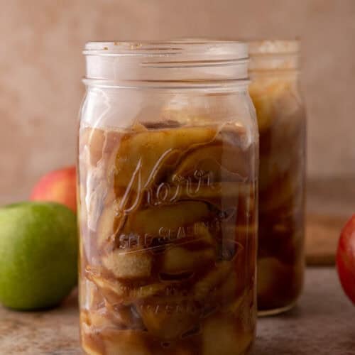 a jar full of the finished product from the how to make apple filling recipe