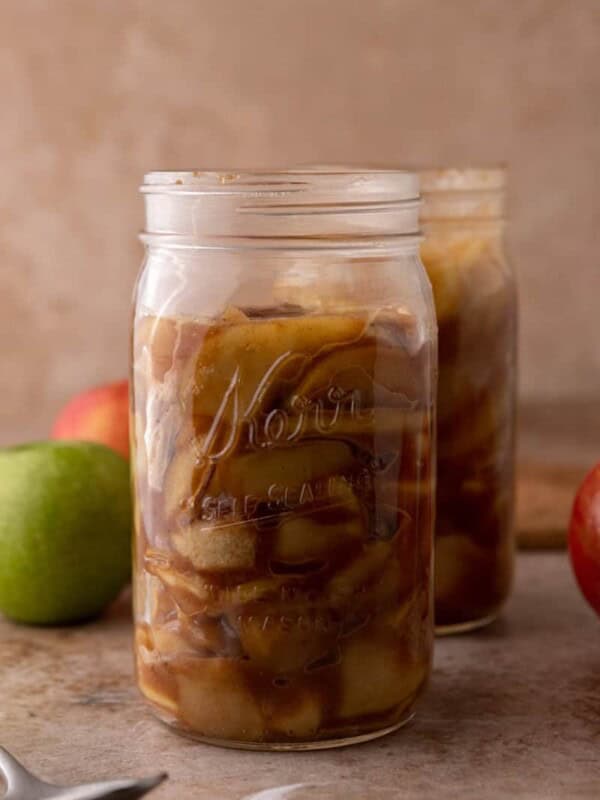 a jar full of the finished product from the how to make apple filling recipe