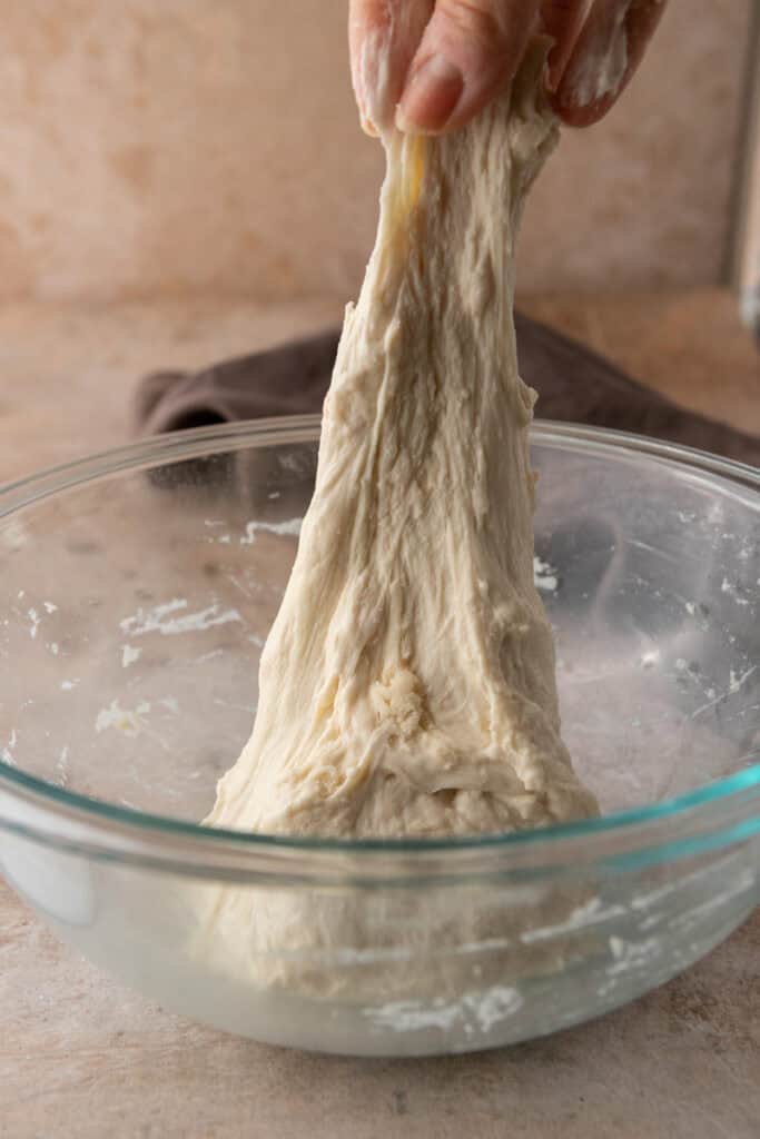 dough getting stretched and folded