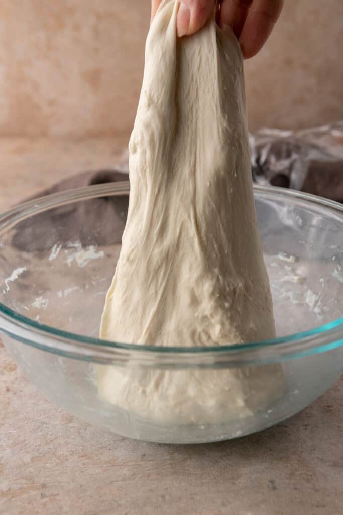 dough getting stretched and folded