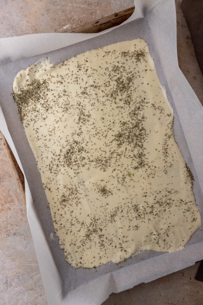 seasoned dough on baking sheet