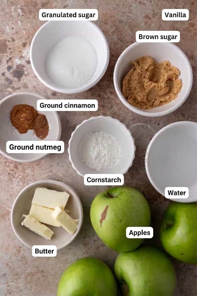 Labeled ingredients for apple filling, including apples, two sugars, butter, warm spices, vanilla, and cornstarch.