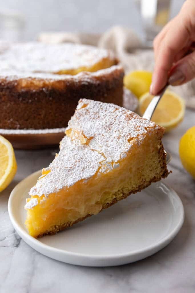 gooey butter lemon cake slice on a plate