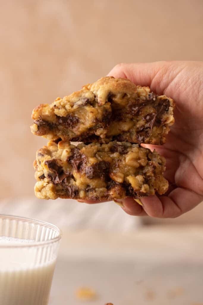 hand holding thick bakery style cookie