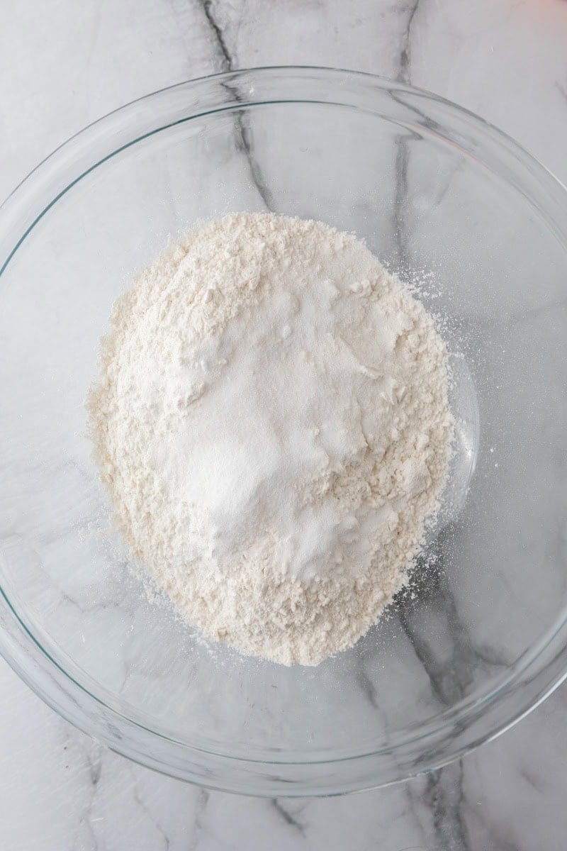 Flour, sugar, and salt in a glass mixing bowl.