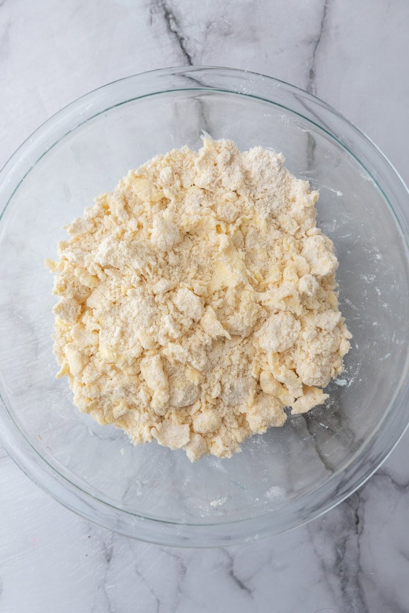 Butter cut into the flour mixture until it looks like coarse crumbs.