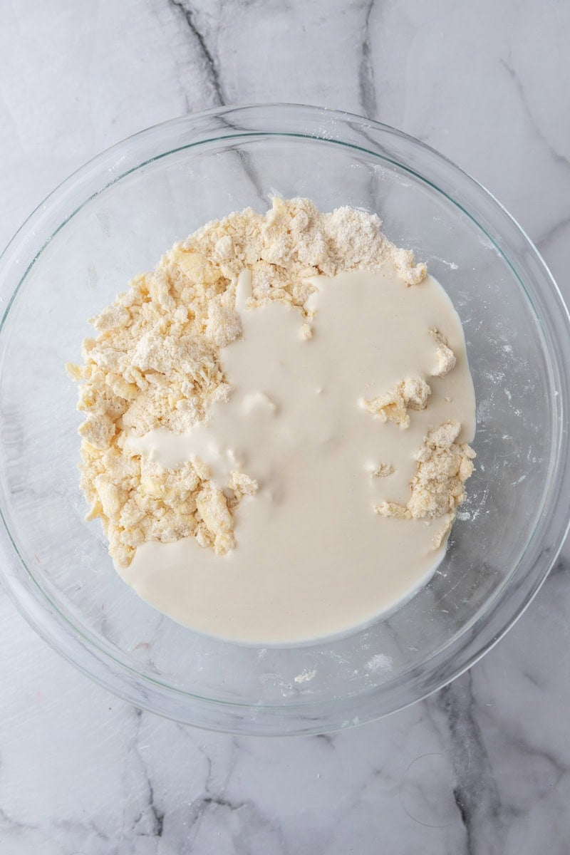Sourdough discard poured over the crumbly flour and butter mixture.