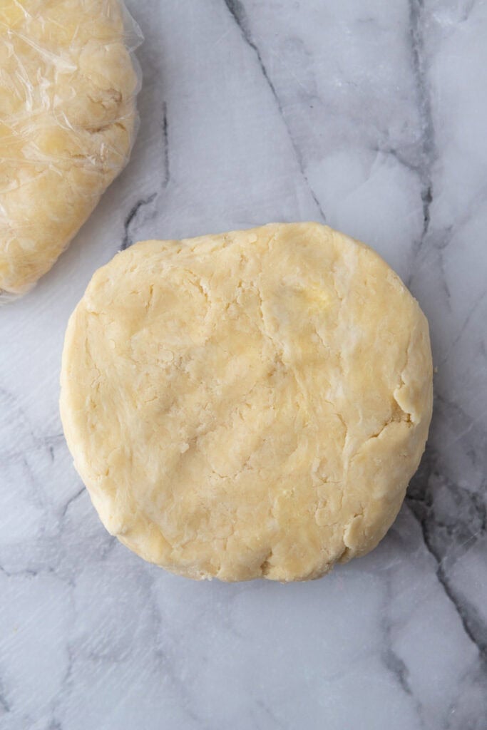 dough pressed into a flat ball