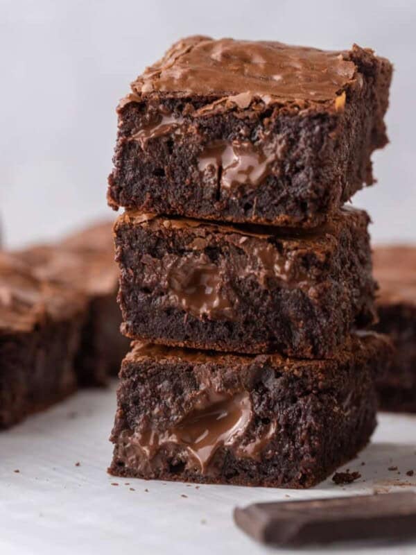 Fudgy Brown Butter Brownies stacked on top of each other