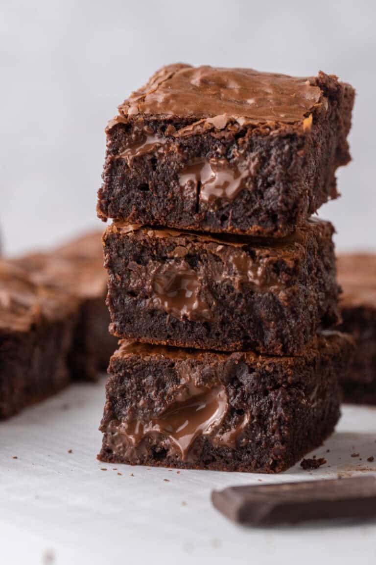 Fudgy Brown Butter Brownies stacked on top of each other