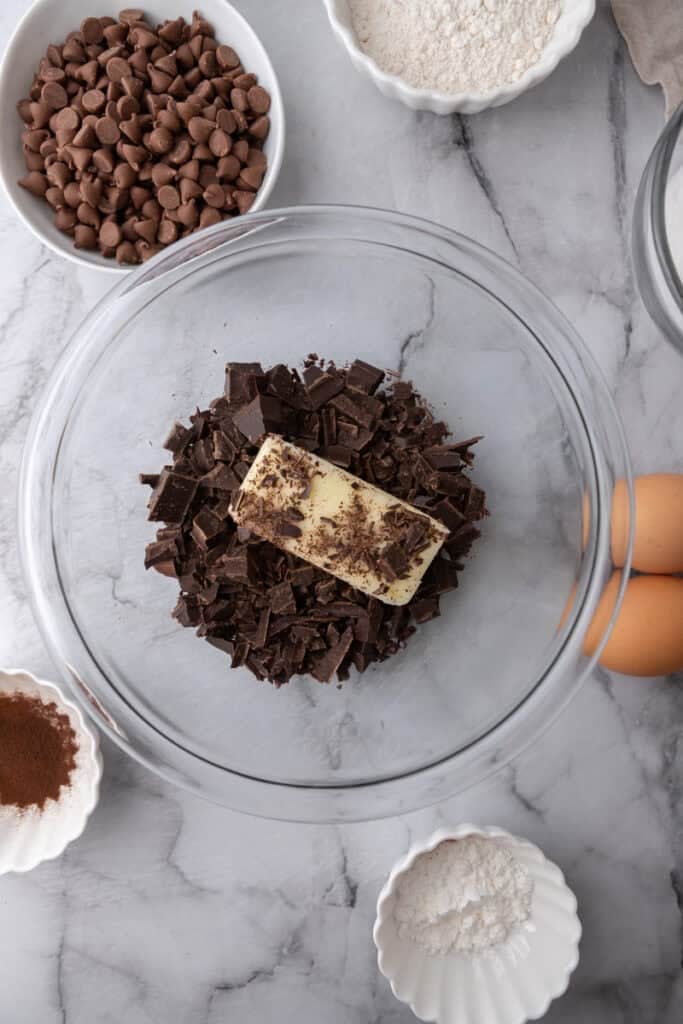 Chopped chocolate with butter and oil in a bowl