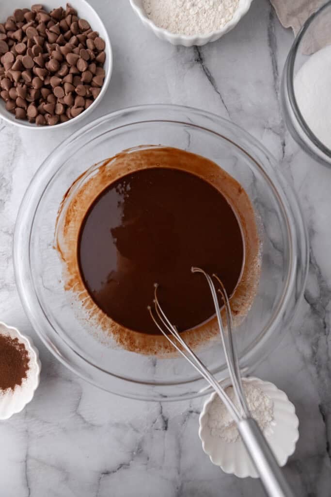 Melted chocolate with butter and oil in a bowl