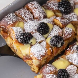 Pretzel French Toast Bake slice being scooped out of the pan