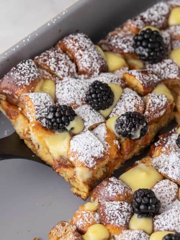 Pretzel French Toast Bake slice being scooped out of the pan