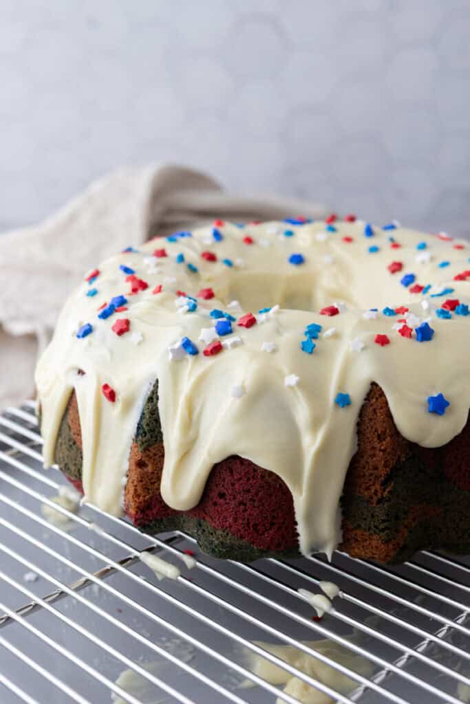 fully made red white and blue bundt cake recipe with frosting on it