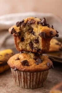 Banana Chocolate Chip Muffins stacked on top of each other