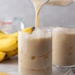 Korean Banana Milk Recipe being poured into a glass
