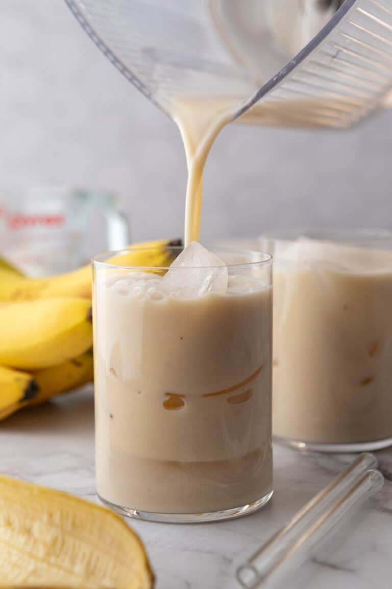 Korean Banana Milk Recipe being poured into a glass