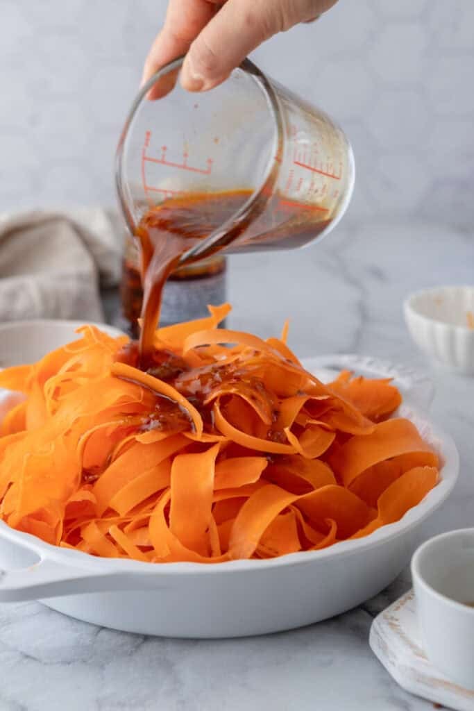 sauce ingredients in a cup getting poured