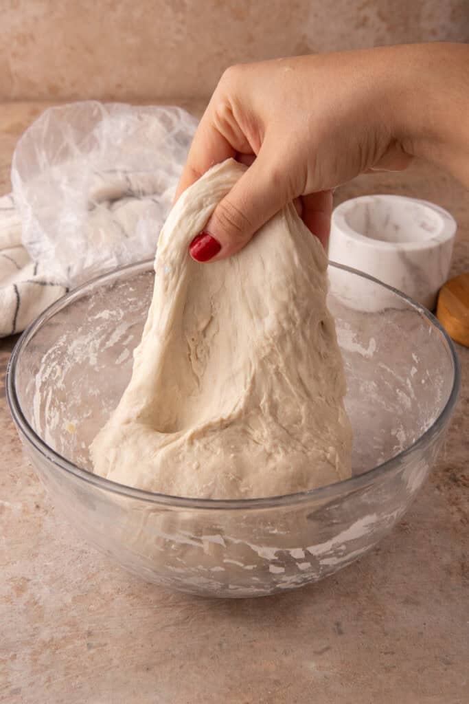 dough getting stretched and folded
