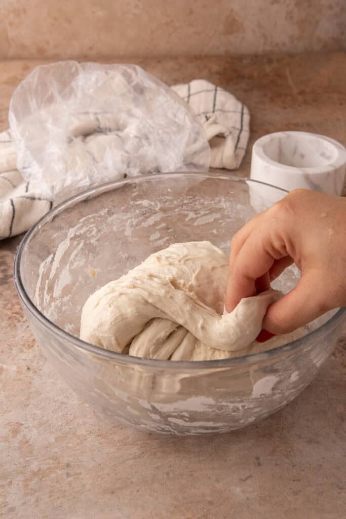 dough getting stretched and folded
