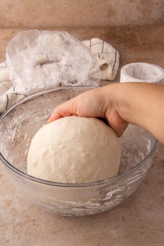 dough getting stretched and folded