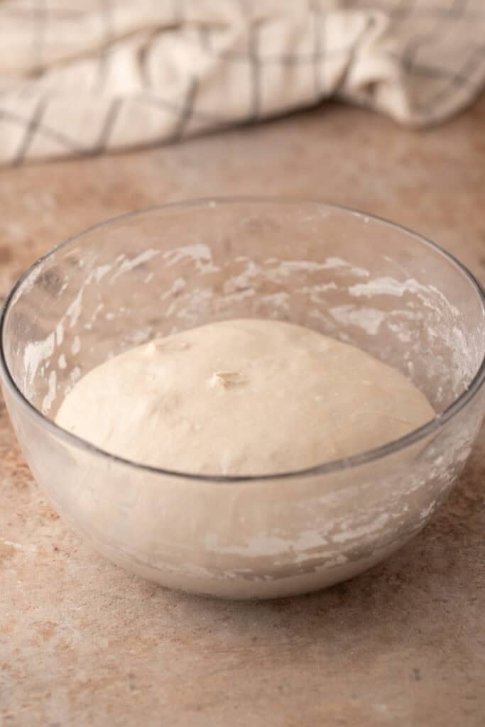 dough getting stretched and folded