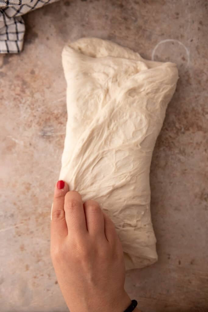 dough lightly pulled and stretched and folded